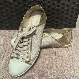 Michael Kors white and gold shoes. Size 8.5! Minor scratches on front of shoe.
